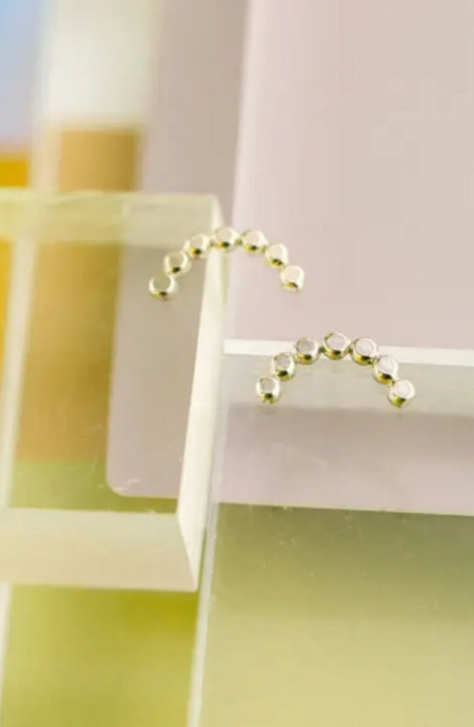 The Land of Salt Hammered Dot Arch Stud Earrings